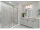 Modern bathroom featuring a glass-enclosed shower, white vanity with quartz countertop and sleek fixtures, and bright lighting at 426 Clear Lake Dr., Conway, SC 29526