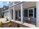 Inviting covered front porch with rocking chairs and manicured landscaping at 426 Clear Lake Dr., Conway, SC 29526