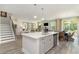 Open kitchen view showcases island with sink, stainless dishwasher, and seamless flow to living and dining areas at 426 Clear Lake Dr., Conway, SC 29526