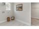 Bright laundry room with tile flooring, open shelving, and a window, offering a clean and functional space at 426 Clear Lake Dr., Conway, SC 29526