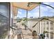 Outdoor balcony featuring tile floors, white railing, potted plants, and patio seating at 4497 Little River Inn Ln. # 1507, Little River, SC 29566