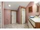 Pink bathroom with white vanity, wood cabinets, and shower featuring shower curtain at 4497 Little River Inn Ln. # 1507, Little River, SC 29566