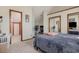 Spacious bedroom featuring carpeting, vaulted ceilings, closets with mirrored doors, and a connected office at 4497 Little River Inn Ln. # 1507, Little River, SC 29566