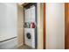 Stacked washer and dryer in closet with bi-fold doors and adjacent to carpeted area at 4497 Little River Inn Ln. # 1507, Little River, SC 29566