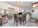 Cozy combined living and dining area featuring neutral carpet and a surfboard on the wall at 4497 Little River Inn Ln. # 1507, Little River, SC 29566