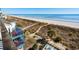 Aerial view of the beach, dunes, and ocean from condo with private balconies and ocean views at 4619 S Ocean Blvd. # 501, North Myrtle Beach, SC 29582