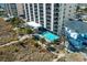 Aerial view of the resort complex with a pool, beach access, and lush landscaping, showcasing the coastal lifestyle at 4619 S Ocean Blvd. # 501, North Myrtle Beach, SC 29582