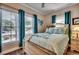 Bright bedroom with a large window, light wood furniture, and beach-themed decor at 4762 Cloister Ln., Myrtle Beach, SC 29577