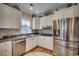 Charming kitchen with stainless steel appliances, granite countertops, and white cabinetry at 4762 Cloister Ln., Myrtle Beach, SC 29577