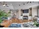 Bright open living room showcasing fireplace, hardwood floors and comfortable seating at 4762 Cloister Ln., Myrtle Beach, SC 29577