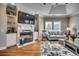 Comfortable living room with fireplace, built-in shelving, and hardwood floors at 4762 Cloister Ln., Myrtle Beach, SC 29577