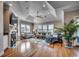 Cozy and bright living room featuring a fireplace, with hardwood floors and tray ceiling at 4762 Cloister Ln., Myrtle Beach, SC 29577