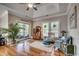 Relaxing living room with hardwood floors and sliding glass door to balcony at 4762 Cloister Ln., Myrtle Beach, SC 29577