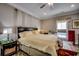 Cozy main bedroom featuring a decorative bedframe, nightstands, and carpeted floors at 4762 Cloister Ln., Myrtle Beach, SC 29577