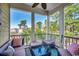 Serene screened porch with comfortable seating and views of lush surroundings at 4762 Cloister Ln., Myrtle Beach, SC 29577