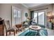 Sitting area featuring decorative chairs, side tables, and sliding glass door at 4762 Cloister Ln., Myrtle Beach, SC 29577