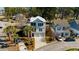 Aerial view of a home boasting a two-car garage, dual balconies, palm trees, and landscaped yard at 4762 Cloisters Ln., Myrtle Beach, SC 29577