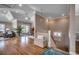 Open-concept living area with hardwood floors, staircase, and access to a screened in porch at 4762 Cloisters Ln., Myrtle Beach, SC 29577