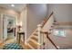 Inviting stairway with wooden steps, white railing, and a view into the living room at 4762 Cloisters Ln., Myrtle Beach, SC 29577