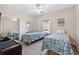 This bright bedroom features two twin beds with matching bedding and ample closet space with mirrored doors at 4889 Magnolia Pointe Ln. # 105, Myrtle Beach, SC 29577