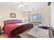 Bedroom with a large window, a wooden sleigh bed, and neutral walls at 4889 Magnolia Pointe Ln. # 105, Myrtle Beach, SC 29577