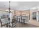 Eat-in kitchen with stainless steel appliances, wood cabinets, granite countertops, and chandelier lighting at 4889 Magnolia Pointe Ln. # 105, Myrtle Beach, SC 29577