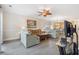 Open-concept living room featuring hardwood floors, a ceiling fan, and access to the kitchen at 4889 Magnolia Pointe Ln. # 105, Myrtle Beach, SC 29577