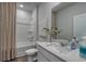 The bathroom features a vanity with white countertop, framed mirror, and a combination tub and shower at 5000 Neverland Ct, Myrtle Beach, SC 29588