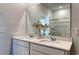 Bathroom featuring dual sinks with a large mirror and plenty of counter space at 5000 Neverland Ct, Myrtle Beach, SC 29588