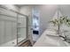 Bathroom featuring a shower with glass door and double sink at 5000 Neverland Ct, Myrtle Beach, SC 29588