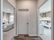 Hallway view of the primary bedroom and secondary bedroom with a bunk bed. Both are decorated with neutral tones at 5000 Neverland Ct, Myrtle Beach, SC 29588