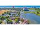 An aerial view shows the condo complex surrounded by greenery and a body of water with a pier in the background at 501 Maison Dr. # F15, Myrtle Beach, SC 29572