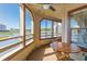 Enclosed porch featuring a wood table perfect for enjoying the outside scenery at 501 Maison Dr. # F15, Myrtle Beach, SC 29572