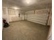 Spacious garage with concrete floor and an open garage door at 516 Tillage Ct., Conway, SC 29526