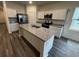 Modern kitchen island with granite countertops, stainless steel appliances and hardwood flooring at 516 Tillage Ct., Conway, SC 29526