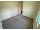 Cozy bedroom featuring soft carpet, neutral walls, and a window for natural light at 519 Tillage Ct., Conway, SC 29526