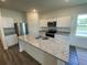 Modern kitchen featuring granite countertops, stainless steel appliances and central island at 519 Tillage Ct., Conway, SC 29526