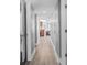 Hallway featuring hardwood floors leading to the kitchen area at 5200 N Ocean Blvd. # Ph36, Myrtle Beach, SC 29577