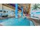 Indoor pool area with a large pool and a mural of a beach at 5200 N Ocean Blvd. # Ph36, Myrtle Beach, SC 29577