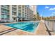 Outdoor pool area with lounge chairs and tropical trees at 5200 N Ocean Blvd. # Ph36, Myrtle Beach, SC 29577