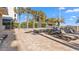 Inviting pool deck with multiple lounge chairs and beautiful clear blue skies with palm trees at 5200 N Ocean Blvd. # Ph36, Myrtle Beach, SC 29577