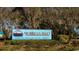 Welcome sign to Murrells Inlet, the seafood capital of South Carolina, surrounded by lush landscaping at 522 Haven View Way, Murrells Inlet, SC 29576