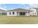 Expansive backyard featuring a covered patio area and plenty of green space for outdoor activities at 526 Haven View Way, Murrells Inlet, SC 29576