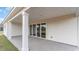 Covered patio features concrete flooring and large white support beams at 526 Haven View Way, Murrells Inlet, SC 29576