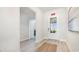 Bright foyer with wood-look flooring, a view of the exit door, and access to other rooms at 526 Haven View Way, Murrells Inlet, SC 29576