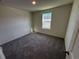 Bedroom with neutral carpet, neutral paint, a window, and white trim at 536 Tillage Ct., Conway, SC 29526