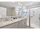 Modern bathroom with dual sinks, granite countertop and walk-in shower at 5519 Redleaf Rose Dr., Myrtle Beach, SC 29579