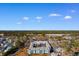 Aerial view of condo complex at 5905 S Kings Hwy with pool and surrounding trees under a bright blue sky at 5905 South Kings Hwy. # 6215D, Myrtle Beach, SC 29575