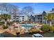 Exterior shot of a community pool area with multiple condos in the background at 5905 South Kings Hwy. # 6215D, Myrtle Beach, SC 29575