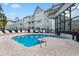 Outdoor pool with lounge chairs at condo complex with brick pavers visible at 5905 South Kings Hwy. # 6215D, Myrtle Beach, SC 29575